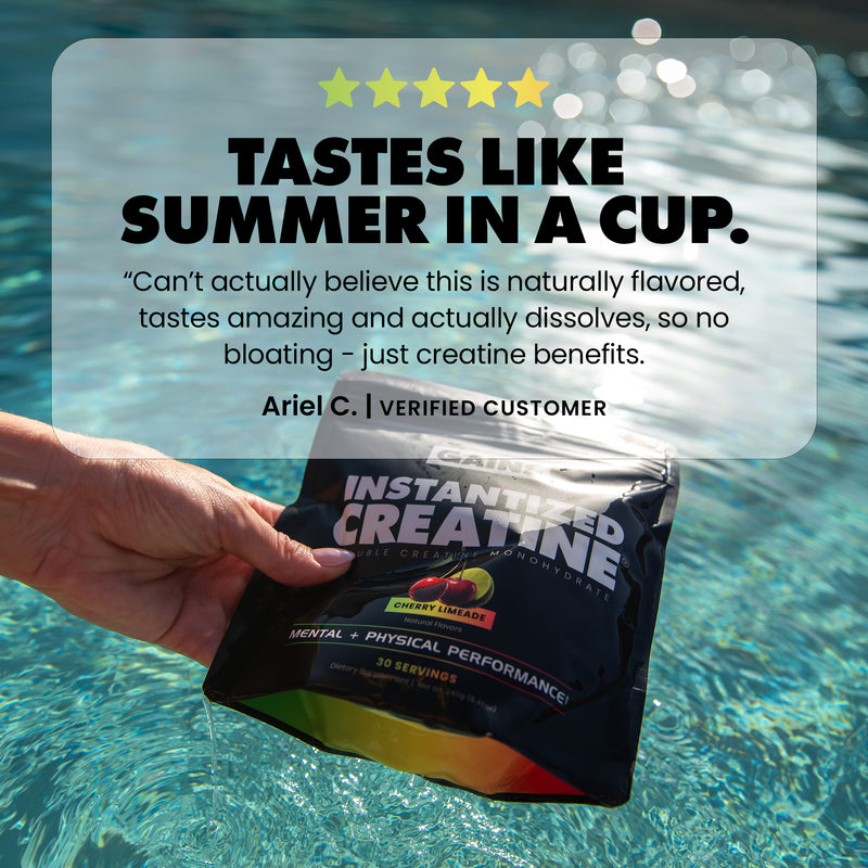 A hand holds a black pouch of Gains Instantized Creatine powder near a swimming pool, with a large promotional text overlay reading 'Tastes Like Summer in a Cup' and a customer testimonial | cherry limeade