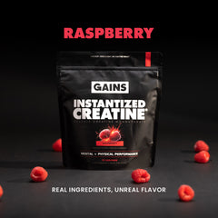Black package of GAINS Instantized Creatine with sour raspberry flavor on a dark background with raspberries. | sour raspberry